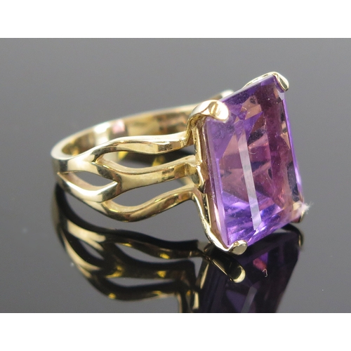 12 - An amethyst ring in a 9ct yellow gold setting, c. 17x13mm stone, size S.25, hallmarked, 8.61g. Boxed