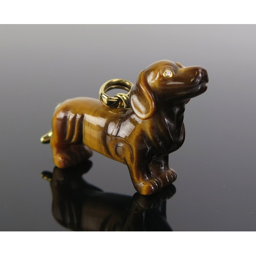 15 - A Braybrook & Britten tiger's eye dachshund pendant with diamond set eyes and 18ct gold tail and mou... 