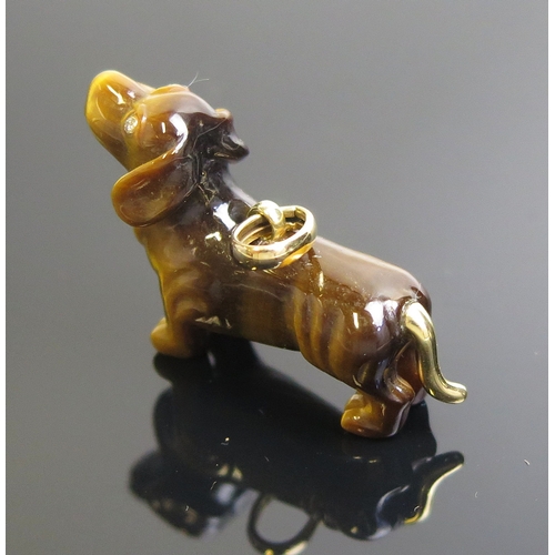 15 - A Braybrook & Britten tiger's eye dachshund pendant with diamond set eyes and 18ct gold tail and mou... 