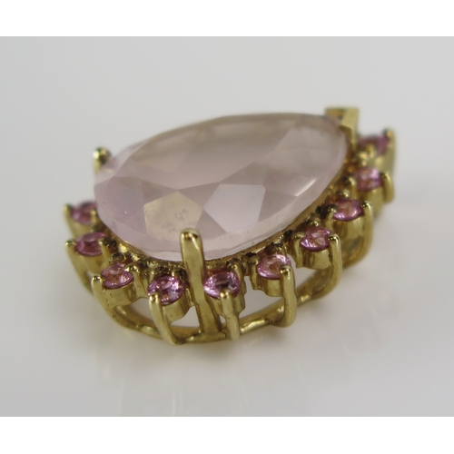 29 - A rose quartz and gem set pear shaped pendant in a 9ct yellow gold setting, 22mm, CCM mark, 4.11g