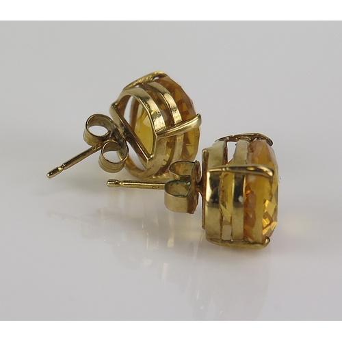 34 - A Shipton & Co. pair of citrine stud earrings in 9ct yellow gold mounts, 12x10mm stones, hallmarked,... 