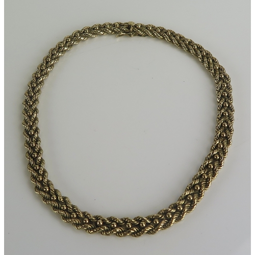 382 - A 9ct gold necklace with rope twist and ball linked decoration, 40cm long, hallmarked, 73.8g. Boxed
