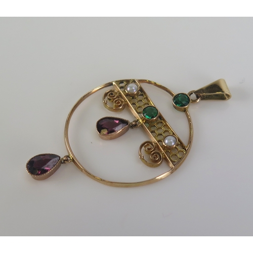 50 - A garnet, seed pearl and paste pendant in a precious yellow metal setting, 47mm drop, KEE tests as 9... 