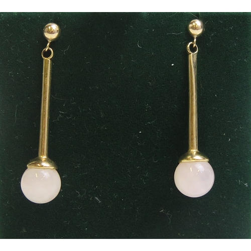 57 - A pair of rose quartz pendant earrings with 9ct yellow gold mounts, 37mm drop, hallmarked, 4.08g. Bo... 