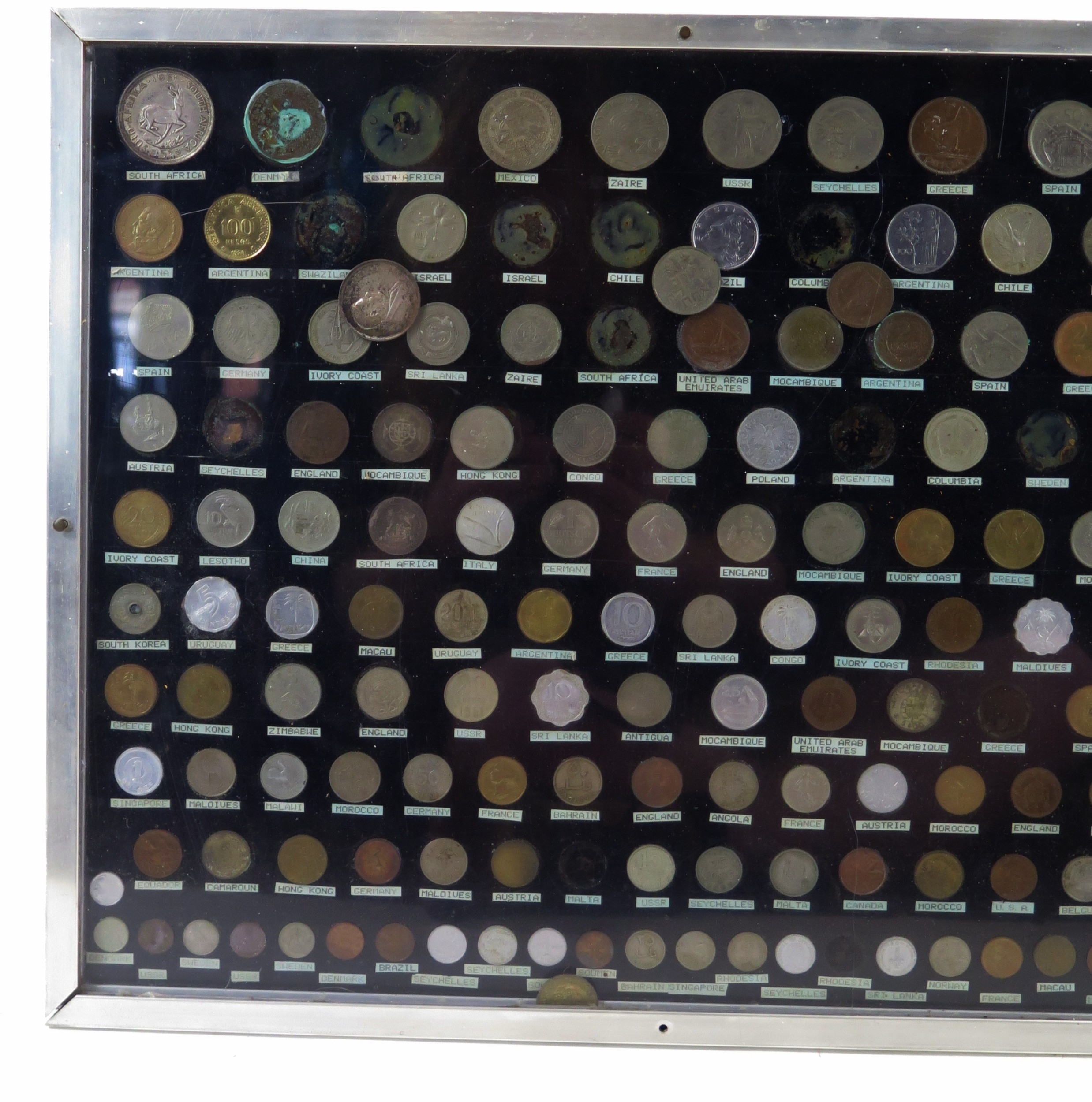 A framed and glazed coin display