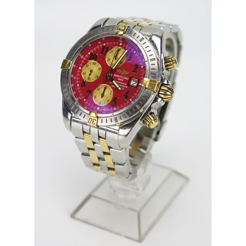 A Breitling Chronomat Evolution steel and gold automatic wristwatch, c. 43mm case, back no. B13356 821592, original steel and gold bracelet. Winds, runs and function buttons working