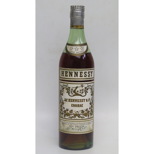 1002 - Hennessy 3 star Cognac 70 proof Circa 1960's (Bras Arme).
ALCOHOL IS SOLD FOR OFF-PERMISES CONSUMPTI... 