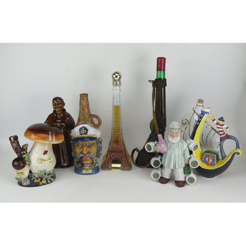 1064 - Bottle of Napoleon Brandy in Eiffel Tower decanter, 50cl, bottle of Aleatico wine in shotgun decante... 
