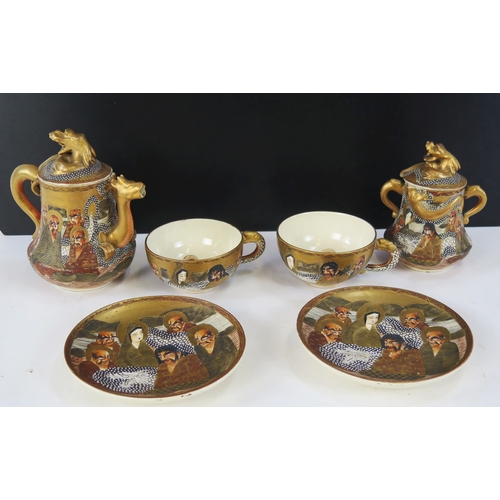 1102A - A Japanese Satsuma part tea service to include two cups and saucers, teapot with cover and jar with ... 