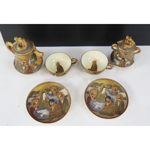 1102A - A Japanese Satsuma part tea service to include two cups and saucers, teapot with cover and jar with ... 