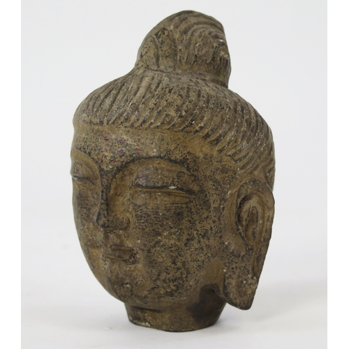 1103 - A carved hardstone Buddha's head, 14cm high.
