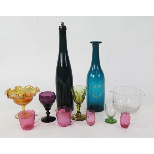 1107 - A blue glass rum bottle, a coloured glass wine bottle, clear glass blending bowl, carnival glass ped... 