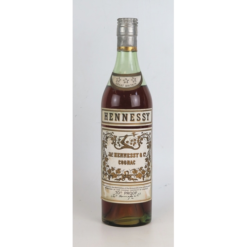1002 - Hennessy 3 star Cognac 70 proof Circa 1960's (Bras Arme).
ALCOHOL IS SOLD FOR OFF-PERMISES CONSUMPTI... 