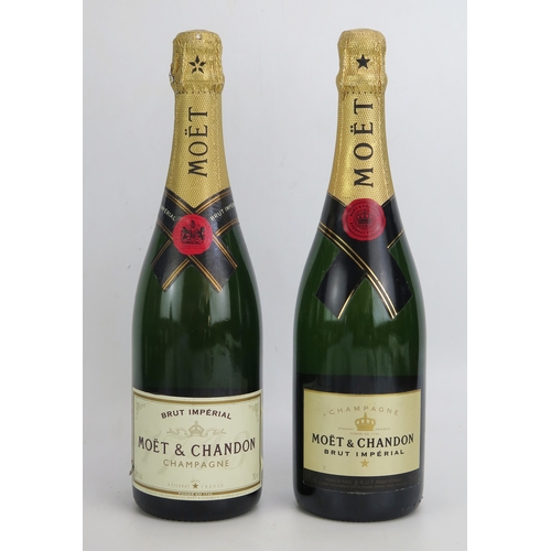 1077 - Two 750ml bottles of Moet & Chandon brut imperial champagne. ALCOHOL IS SOLD FOR OFF-PERMISES CONSUM... 