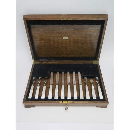 532 - A set of six George VI silver and M-O-P handled fruit knives and six forks, maker C W Fletcher & Son... 
