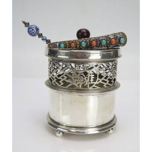 533 - A Chinese silver gilt, turquoise and enamel brooch in the form of a finger guard, the filigree frame... 