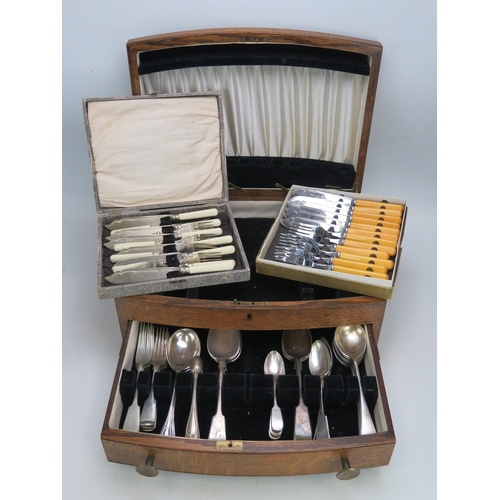 534 - A quantity of assorted plated flatwares contained in an oak canteen, together with two sets of fish ... 