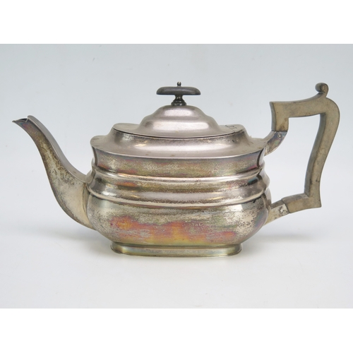 535 - A George V silver teapot, maker William Hutton & Sons Ltd, Sheffield, 1915, of barge -shaped outline... 