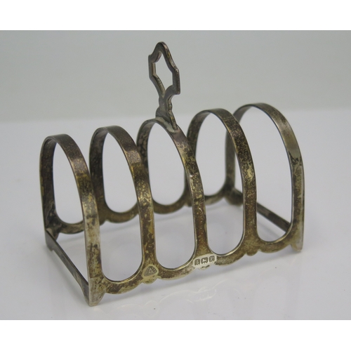 537 - A George V silver four division toast rack, maker Adie brothers, Birmingham, 1915, 7.5cm long, 38gms... 
