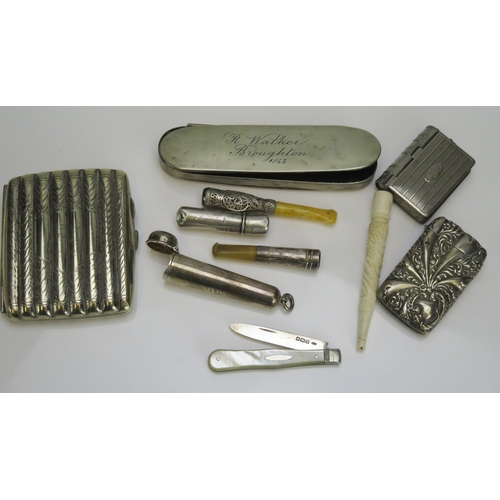 548 - A small selection of silver and plated wares to include vesta cases, cheroot holder cases, cigarette... 