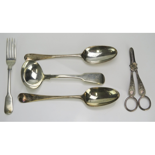 556 - A mixed collection of silver flatwares, various makers and dates, includes grape shears, sauce ladle... 