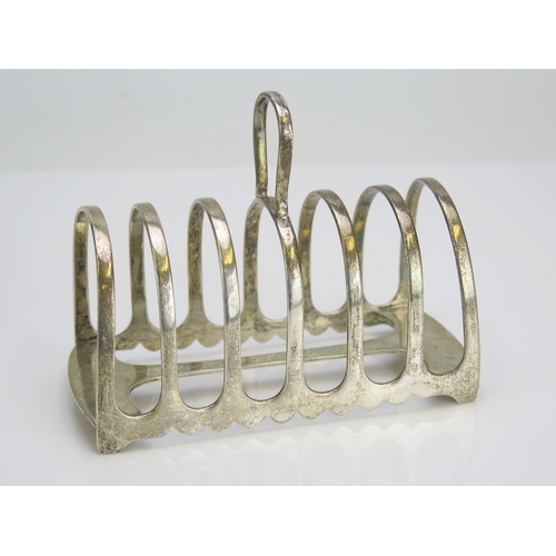 557 - A George V silver toast rack, maker James Dixon & Sons Ltd, Sheffield, 1920, of traditional design, ... 