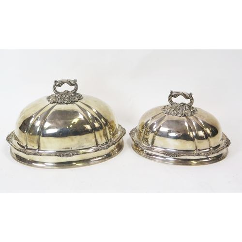 561 - Two silver plated graduated meat dish covers, of domed outline with piecrust borders and shell decor... 