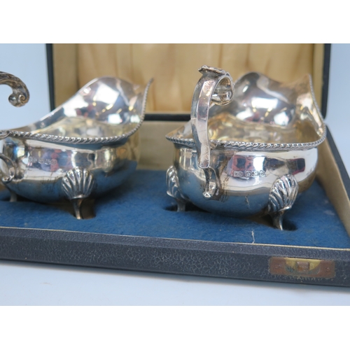 563 - A pair of George VI silver sauce boats, maker Harrison Brothers & Howson, Sheffield 1945, each with ... 