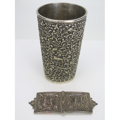 575 - An Indian silver plated beaker with embossed foliate decoration, 12cm high, together with an Indian ... 