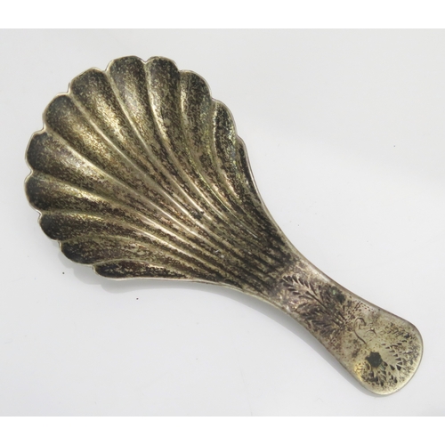 589 - A William IV silver caddy spoon, maker Taylor & Perry, Birmingham, 1835, with shell shaped bowl and ... 
