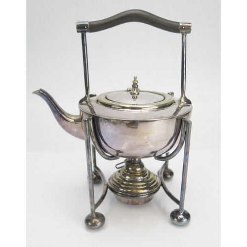 596 - A plated spirit kettle stand and burner in the Christopher Dresser style, with ebonised handle, hing... 