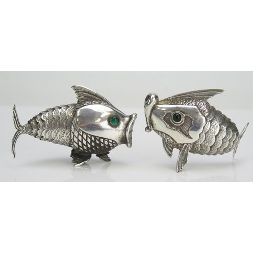 586 - A pair of Spanish silver condiments in the form of articulated fish, with inset green glass eyes, st... 