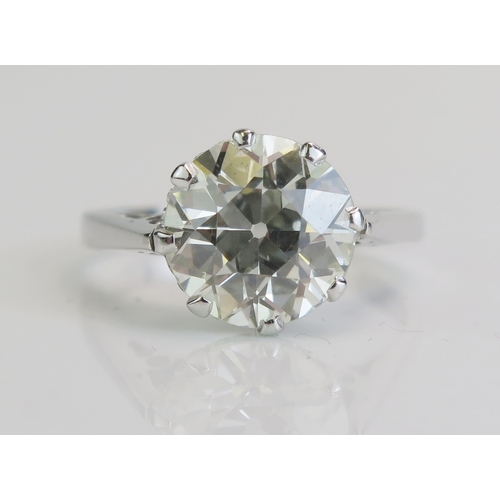A natural diamond solitaire ring in an 18ct white gold setting, the brilliant round cut stone measuring c. 9.7mm, size M.5, stamped 18CT, 3.67g