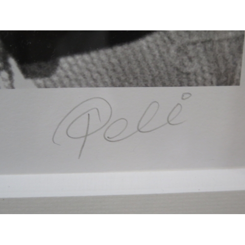 15 - Pele, signed monochrome photographic print of Mohamed Ali and Pele, signed in pencil to the margin, ... 