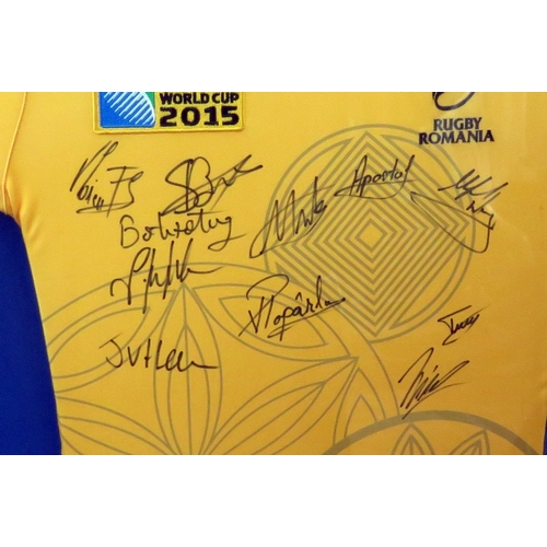 17A - A signed Romanian rugby shirt from the 2015 Rugby World Cup, mounted, framed and glazed.