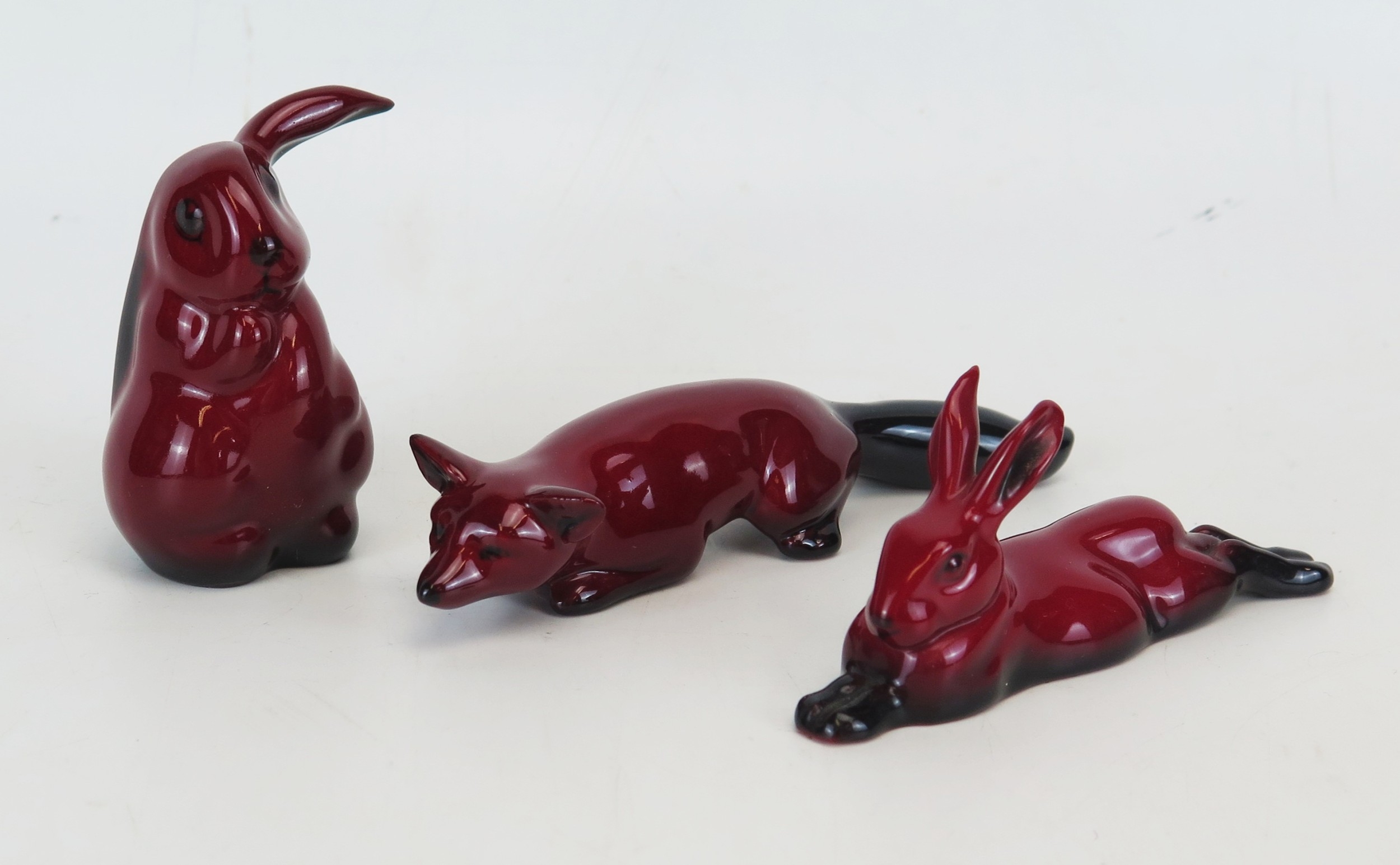 Three miniature Royal Doulton Flambé Figurines including Rabbit, hare ...