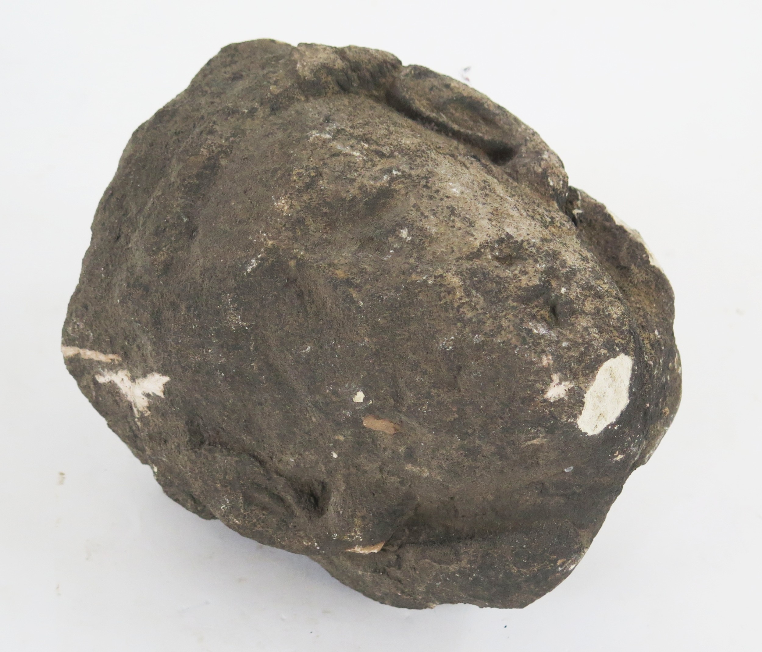 A medieval carved stone corbel in the form of a man's head. 20cm high.
