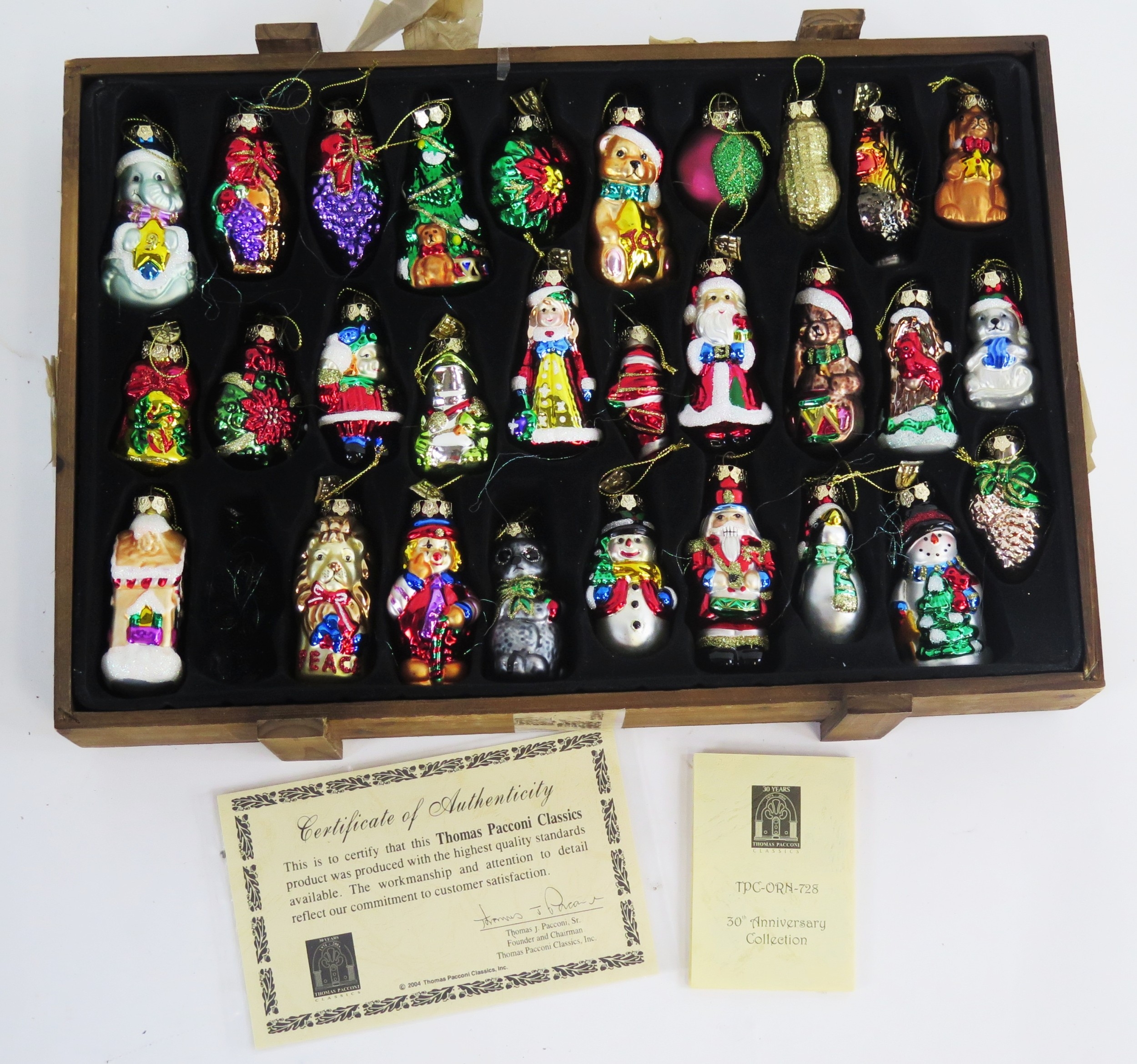 A collection of Thomas Pacconi Christmas tree decorations, contained in ...