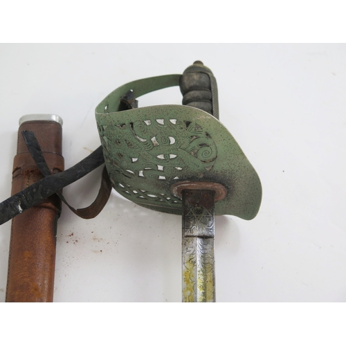 A George V Officer's sword, the 80cm fullered blade with etched Royal ...
