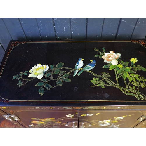 A 20th century lacquered and painted side cabinet in the Chinoiserie ...