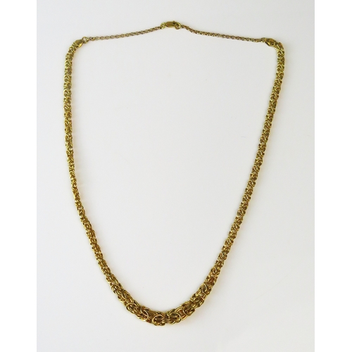 A fancy graduated chain link necklace, 55cm long, stamped 375, 13.26g