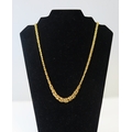 A fancy graduated chain link necklace, 55cm long, stamped 375, 13.26g
