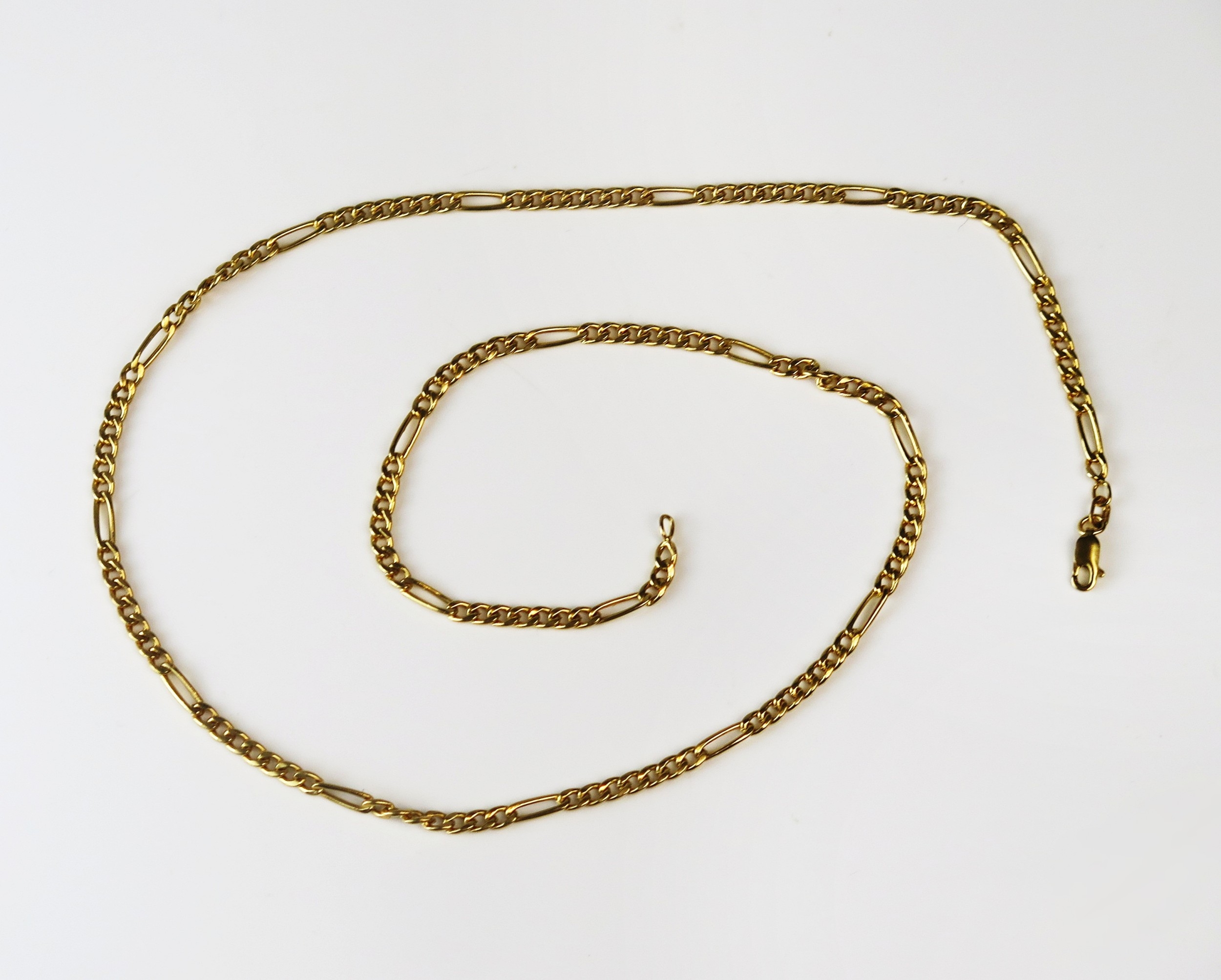A 9ct yellow gold figaro chain necklace, 58cm long, hallmarked, 6.76g