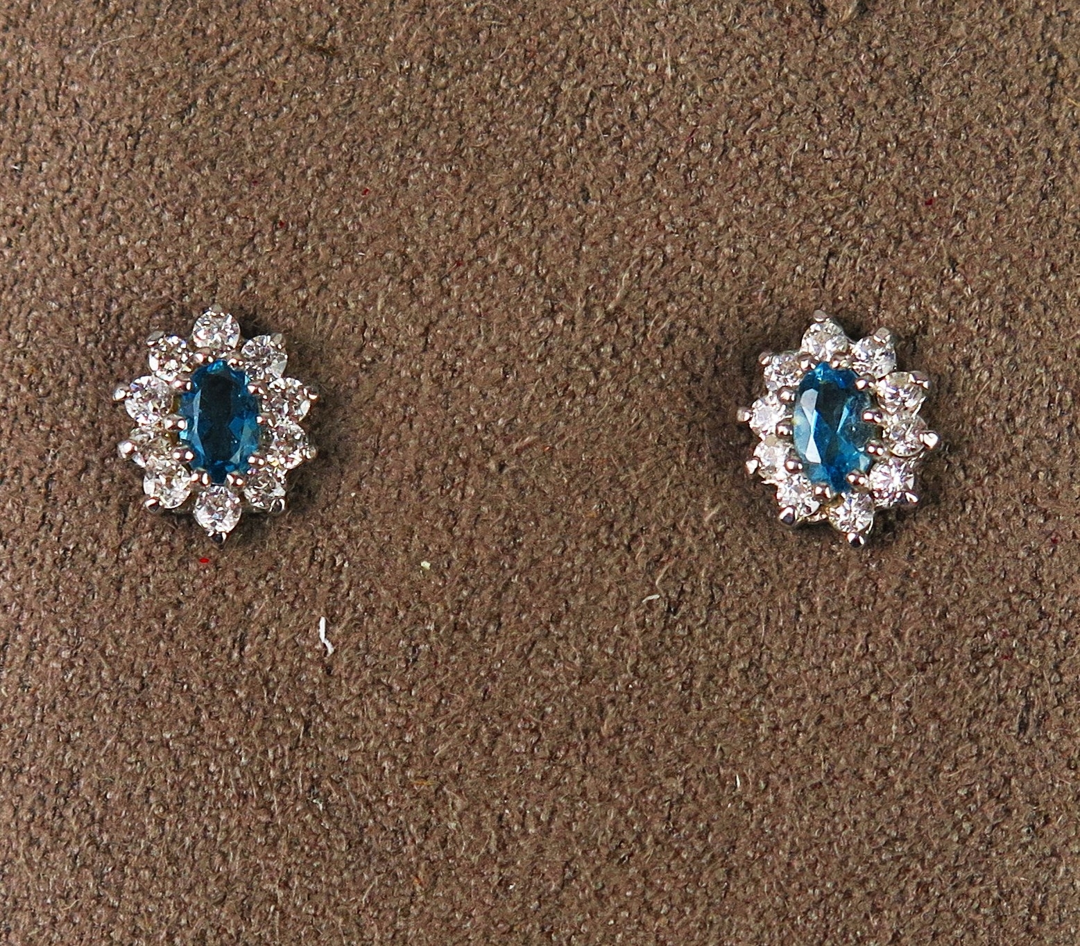 A pair of blue topaz and paste cluster stud earrings, hallmarked, 1.23g