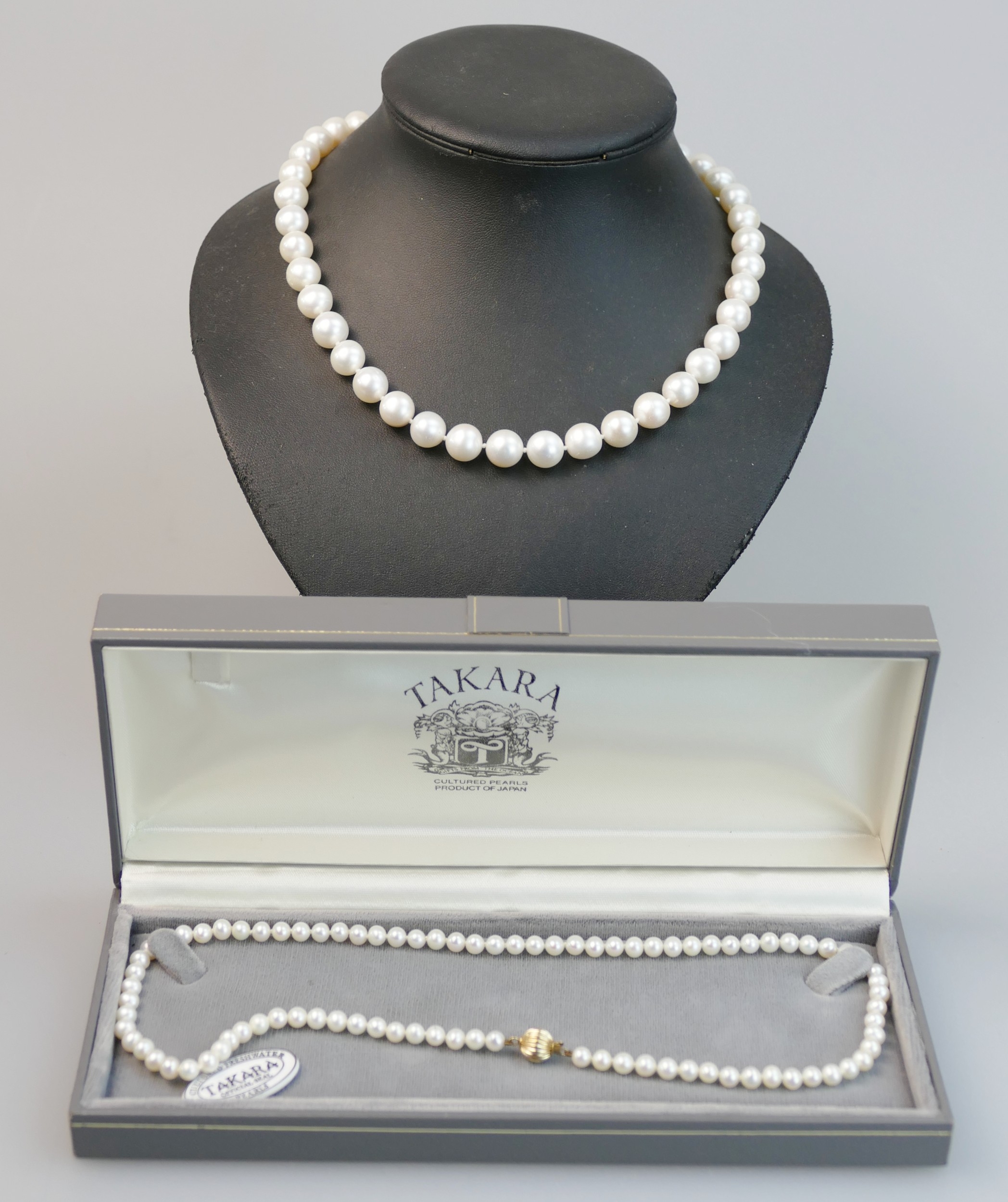 A large cultured pearl necklace with an 18ct yellow gold clasp and one ...