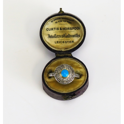 A turquoise and rose cut diamond target ring in a high carat precious ...