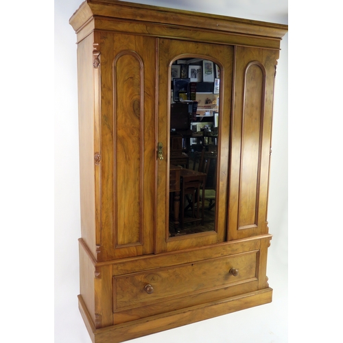 A late Victorian satin walnut wardrobe, of rectangular outline with ...