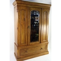 A late Victorian satin walnut wardrobe, of rectangular outline with ...
