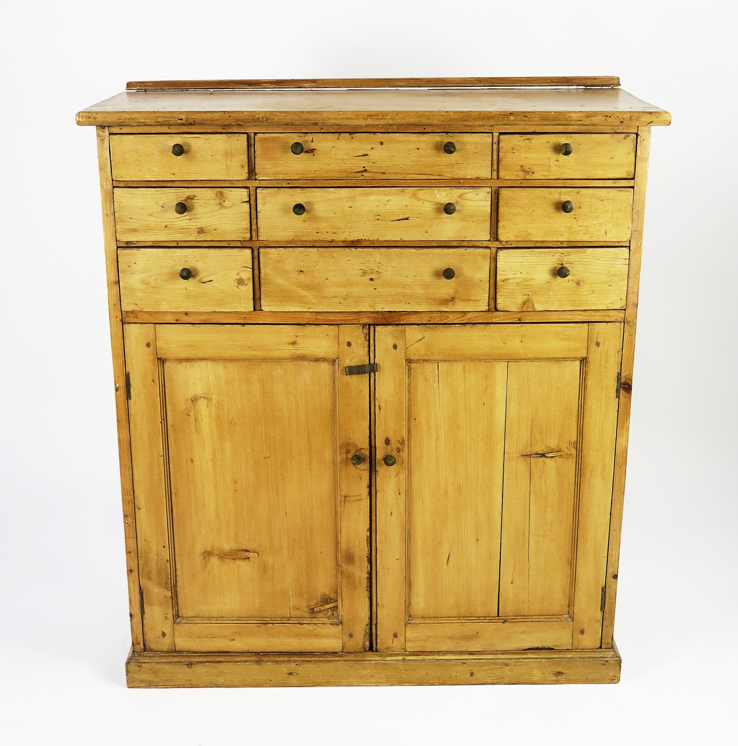 A Victorian pine sideboard, with six short drawers flanking three long ...