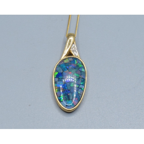 Superb 9ct gold oval Opal and Diamond pendant necklace 2.7cm drop held on a 9ct gold neck chain of 40cm long 2.3grams